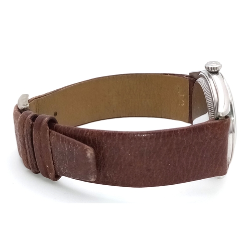178 - A Vintage Rolex Oyster Mechanical Gents Watch. Model 4499. Brown leather strap. Stainless steel case... 