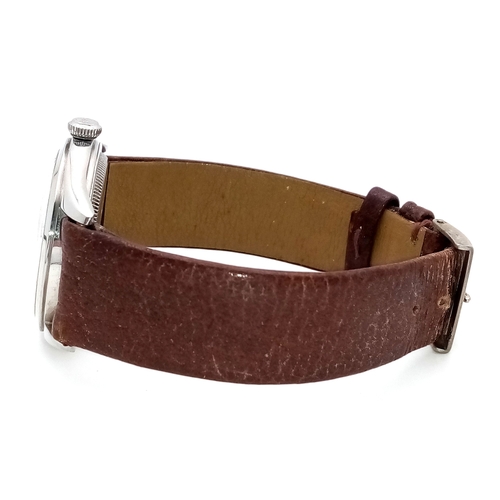 178 - A Vintage Rolex Oyster Mechanical Gents Watch. Model 4499. Brown leather strap. Stainless steel case... 