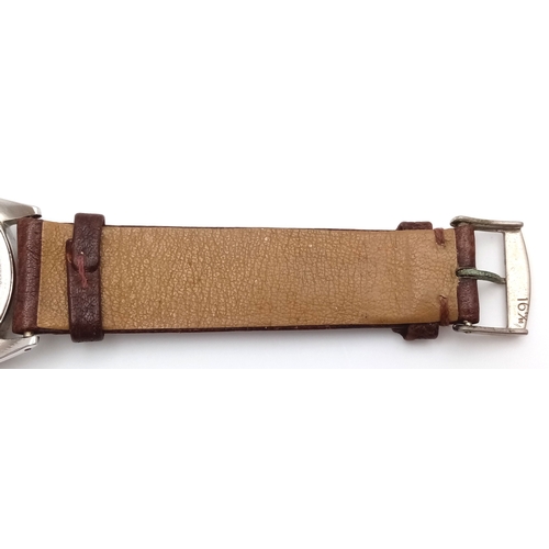 178 - A Vintage Rolex Oyster Mechanical Gents Watch. Model 4499. Brown leather strap. Stainless steel case... 
