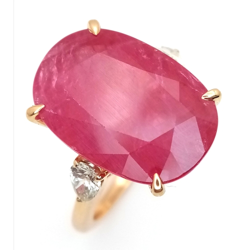 An IGI Certified 18K Yellow Gold (tests as) Ruby and Diamond Cocktail Ring. A 14.29ct natural cushion cut ruby flanked by two pear cut diamonds - 0.42ctw having K-L colour and SI clarity. Size N 1/2. 7.28g total weight. Ref: LXR-90063.