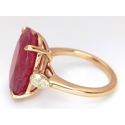 25 - An IGI Certified 18K Yellow Gold (tests as) Ruby and Diamond Cocktail Ring. A 14.29ct natural cushio... 
