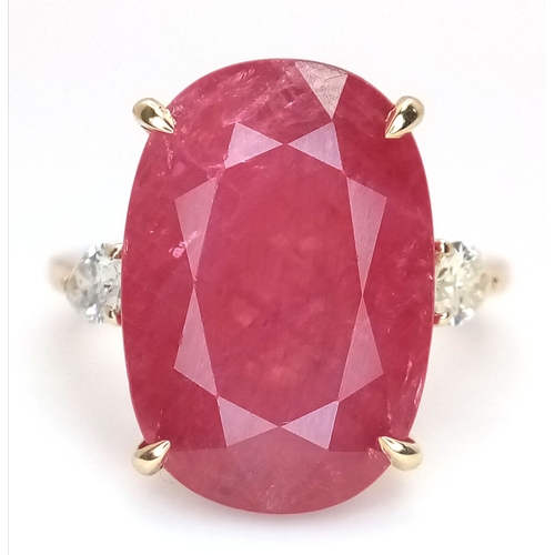 25 - An IGI Certified 18K Yellow Gold (tests as) Ruby and Diamond Cocktail Ring. A 14.29ct natural cushio... 