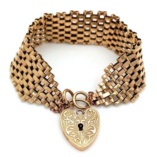 A VINTAGE 6-BAR GATE BRACELET IN 9K GOLD WITH ORNATE PADLOCK CLASP. BROKEN SAFETY CHAIN. 27.3g  18cm