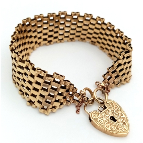 1 - A VINTAGE 6-BAR GATE BRACELET IN 9K GOLD WITH ORNATE PADLOCK CLASP. BROKEN SAFETY CHAIN. 27.3g  18cm