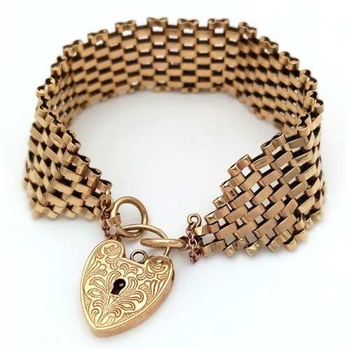 1 - A VINTAGE 6-BAR GATE BRACELET IN 9K GOLD WITH ORNATE PADLOCK CLASP. BROKEN SAFETY CHAIN. 27.3g  18cm