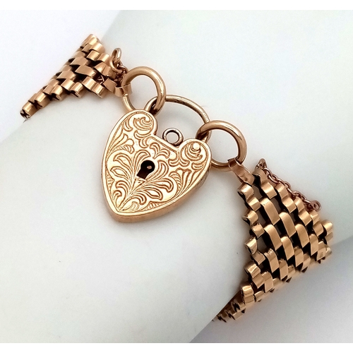 1 - A VINTAGE 6-BAR GATE BRACELET IN 9K GOLD WITH ORNATE PADLOCK CLASP. BROKEN SAFETY CHAIN. 27.3g  18cm