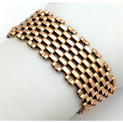 1 - A VINTAGE 6-BAR GATE BRACELET IN 9K GOLD WITH ORNATE PADLOCK CLASP. BROKEN SAFETY CHAIN. 27.3g  18cm