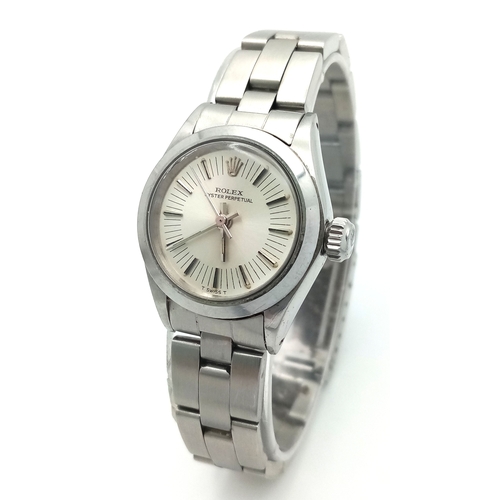A Ladies 1970&rsquo;s Stainless Steel Oyster Perpetual Rolex Watch - fitted with Sun-burst Dial. Case -26mm. Automatic movement. Complete with Box and Papers. In working order. 78340/566-3729961 (3314731). Ref 0184.