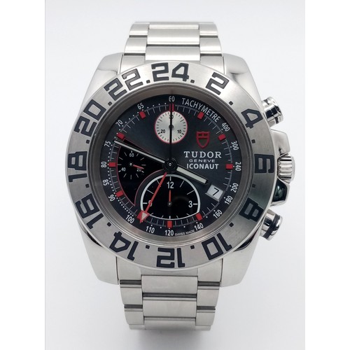 A Tudor Iconaut Automatic Chronograph Gents Watch. Stainless steel bracelet and case - 43mm. Silver tone dial with second time zone and three sub dials. Twenty-four hour bezel. In very good condition and working order.