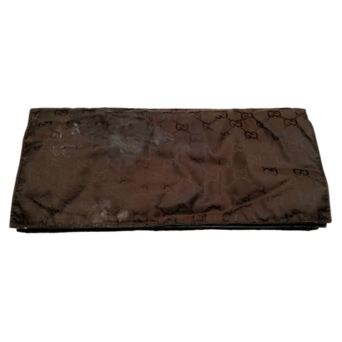 1017 - A Gucci GG Plus Monogram Messenger Diaper Bag. Beige and brown GG monogram coated canvas exterior wi... 