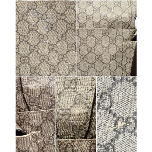 1017 - A Gucci GG Plus Monogram Messenger Diaper Bag. Beige and brown GG monogram coated canvas exterior wi... 