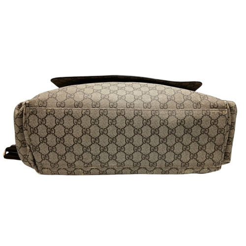 1017 - A Gucci GG Plus Monogram Messenger Diaper Bag. Beige and brown GG monogram coated canvas exterior wi... 