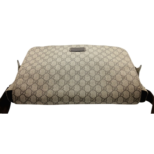 1017 - A Gucci GG Plus Monogram Messenger Diaper Bag. Beige and brown GG monogram coated canvas exterior wi... 