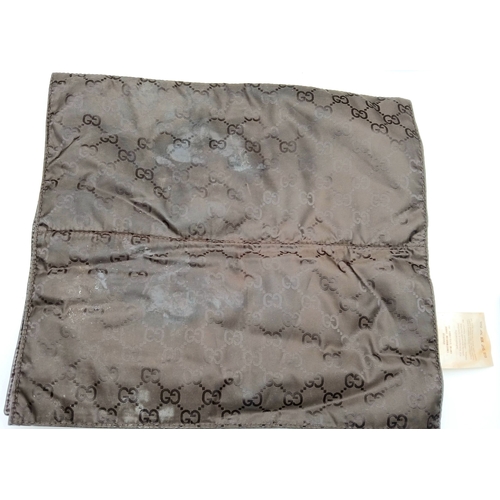 1017 - A Gucci GG Plus Monogram Messenger Diaper Bag. Beige and brown GG monogram coated canvas exterior wi... 
