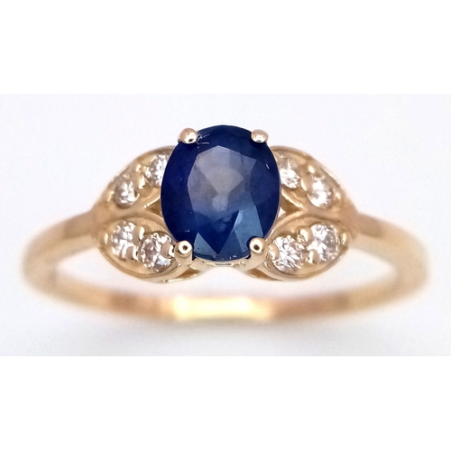 60 - A 14K Yellow Gold Natural Sapphire and Diamond Cocktail Ring. A 1.11ct oval cut sapphire with diamon... 