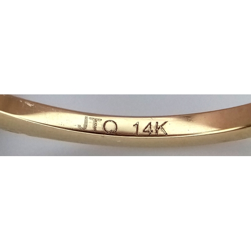 60 - A 14K Yellow Gold Natural Sapphire and Diamond Cocktail Ring. A 1.11ct oval cut sapphire with diamon... 