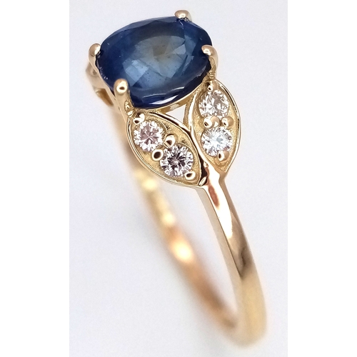 60 - A 14K Yellow Gold Natural Sapphire and Diamond Cocktail Ring. A 1.11ct oval cut sapphire with diamon... 