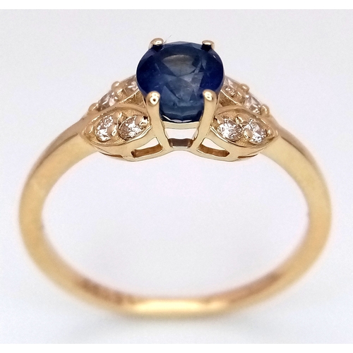 60 - A 14K Yellow Gold Natural Sapphire and Diamond Cocktail Ring. A 1.11ct oval cut sapphire with diamon... 