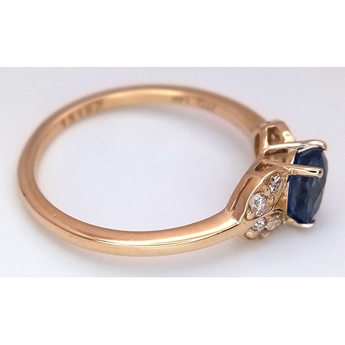 60 - A 14K Yellow Gold Natural Sapphire and Diamond Cocktail Ring. A 1.11ct oval cut sapphire with diamon... 