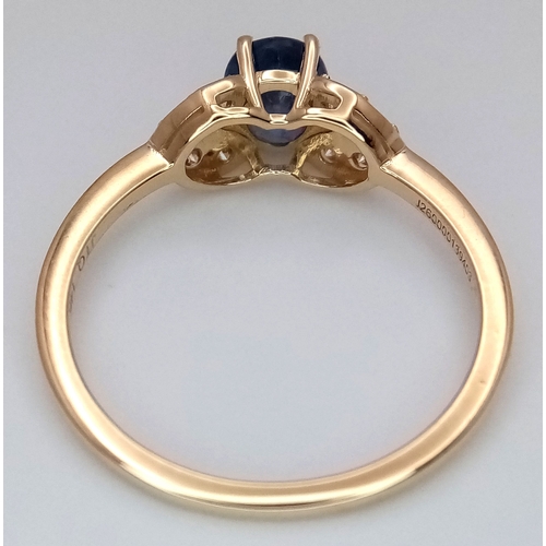 60 - A 14K Yellow Gold Natural Sapphire and Diamond Cocktail Ring. A 1.11ct oval cut sapphire with diamon... 