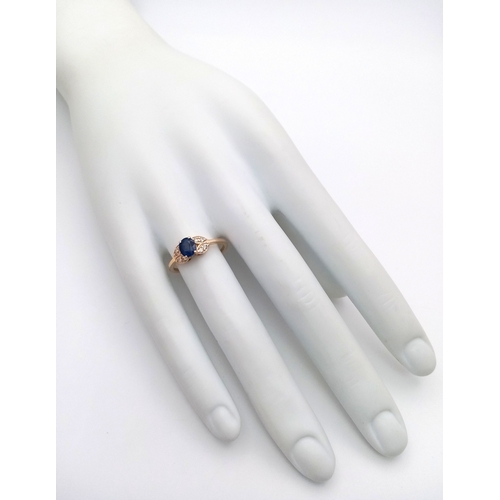 60 - A 14K Yellow Gold Natural Sapphire and Diamond Cocktail Ring. A 1.11ct oval cut sapphire with diamon... 