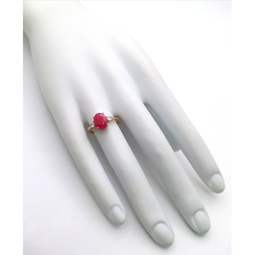 67 - A 14K Yellow Gold Natural Ruby and Diamond Cocktail Ring. A 2.71ct oval cut ruby with diamond accent... 