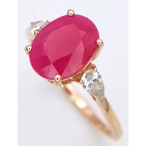 67 - A 14K Yellow Gold Natural Ruby and Diamond Cocktail Ring. A 2.71ct oval cut ruby with diamond accent... 
