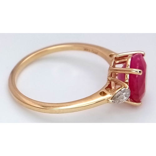67 - A 14K Yellow Gold Natural Ruby and Diamond Cocktail Ring. A 2.71ct oval cut ruby with diamond accent... 