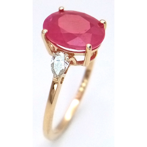 67 - A 14K Yellow Gold Natural Ruby and Diamond Cocktail Ring. A 2.71ct oval cut ruby with diamond accent... 