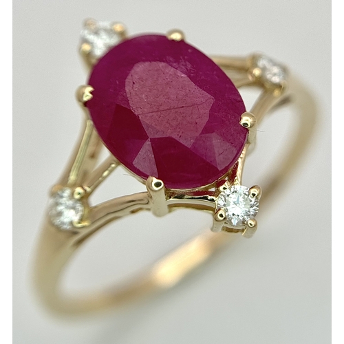 88 - A 14K Yellow Gold Natural Ruby and Diamond Cocktail Ring. A 2.19ct oval cut ruby with compass point ... 