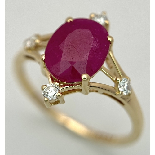 88 - A 14K Yellow Gold Natural Ruby and Diamond Cocktail Ring. A 2.19ct oval cut ruby with compass point ... 