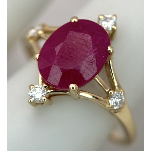 88 - A 14K Yellow Gold Natural Ruby and Diamond Cocktail Ring. A 2.19ct oval cut ruby with compass point ... 