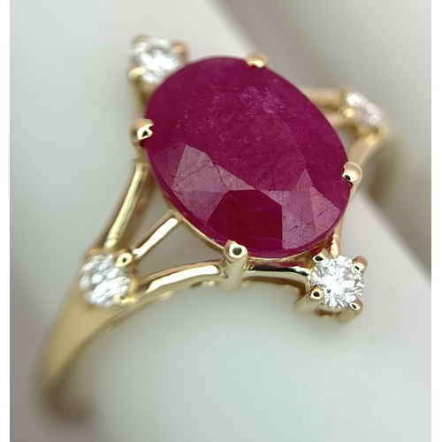 88 - A 14K Yellow Gold Natural Ruby and Diamond Cocktail Ring. A 2.19ct oval cut ruby with compass point ... 