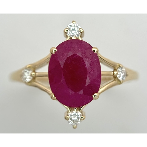 88 - A 14K Yellow Gold Natural Ruby and Diamond Cocktail Ring. A 2.19ct oval cut ruby with compass point ... 