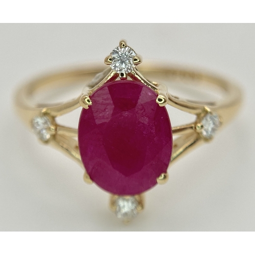 88 - A 14K Yellow Gold Natural Ruby and Diamond Cocktail Ring. A 2.19ct oval cut ruby with compass point ... 