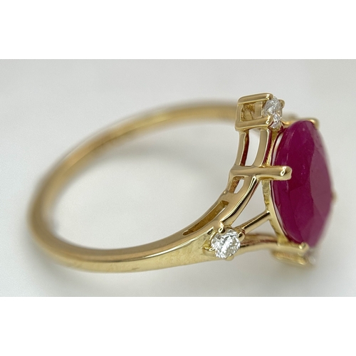 88 - A 14K Yellow Gold Natural Ruby and Diamond Cocktail Ring. A 2.19ct oval cut ruby with compass point ... 