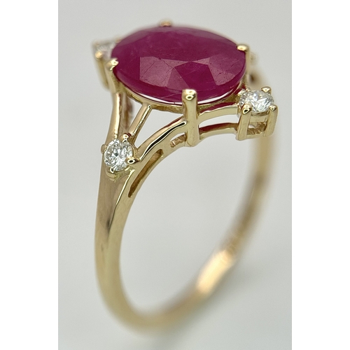88 - A 14K Yellow Gold Natural Ruby and Diamond Cocktail Ring. A 2.19ct oval cut ruby with compass point ... 