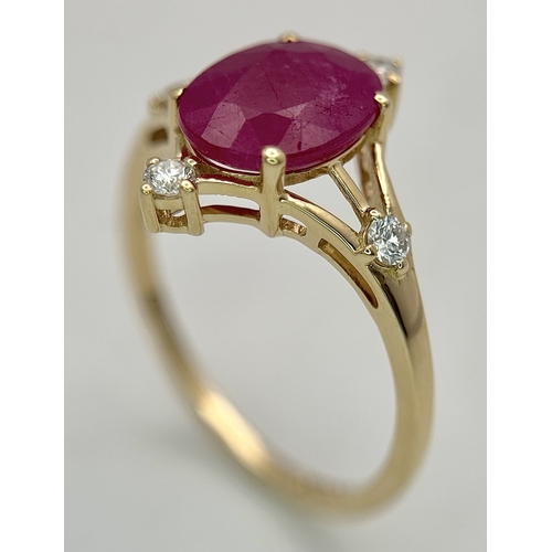 88 - A 14K Yellow Gold Natural Ruby and Diamond Cocktail Ring. A 2.19ct oval cut ruby with compass point ... 