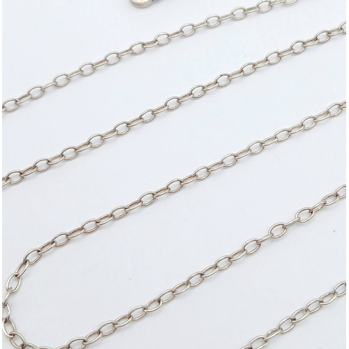 57 - A 925 silver necklace with a dual-disc pendant. Total weight 21g. Approx 84cm length with a 7cm pend... 