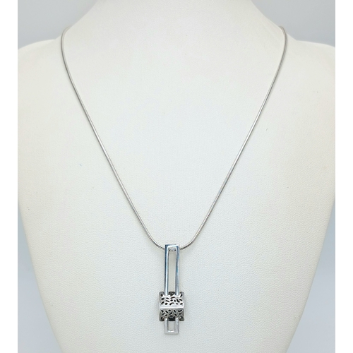 50 - A Stylish 925 Sterling Silver Geometric Drop Pendant Necklace - 44cm Length. Features an openwork ge... 