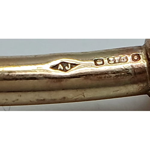 29 - A 9K Yellow Gold Torque Bangle. Bulbous ends. 4g.