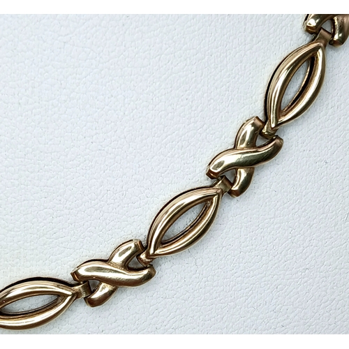 36 - A 9K Yellow Gold 'Hugs and Kisses' Chain Necklace. 42cm. 11.7g.