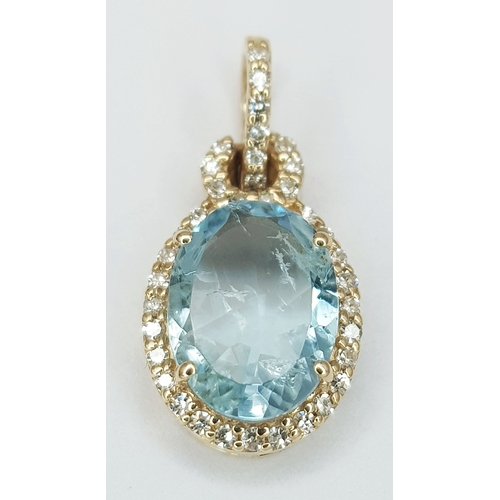 95 - A 14K Yellow Gold Natural Aquamarine and Diamond Pendant. A 1.15ct oval mixed cut natural aquamarine... 