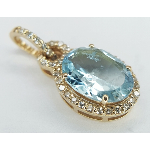 95 - A 14K Yellow Gold Natural Aquamarine and Diamond Pendant. A 1.15ct oval mixed cut natural aquamarine... 