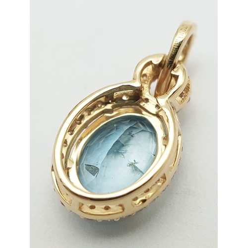 95 - A 14K Yellow Gold Natural Aquamarine and Diamond Pendant. A 1.15ct oval mixed cut natural aquamarine... 
