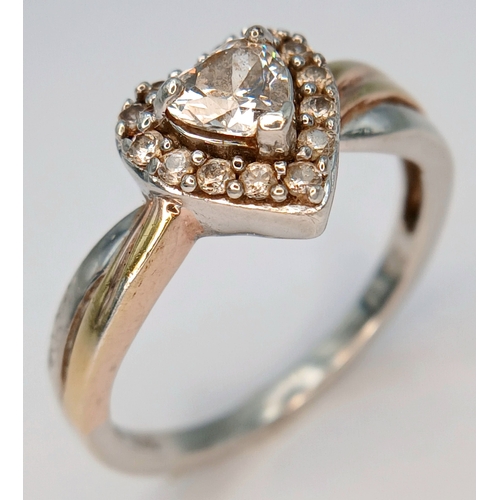 31 - A Sparkling 925 Sterling Silver CZ Set Heart Ring - Size O 1/2. The ring is set with a central heart... 