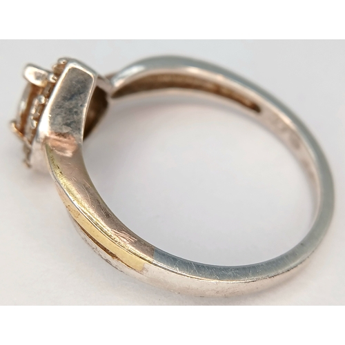 31 - A Sparkling 925 Sterling Silver CZ Set Heart Ring - Size O 1/2. The ring is set with a central heart... 