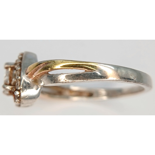 31 - A Sparkling 925 Sterling Silver CZ Set Heart Ring - Size O 1/2. The ring is set with a central heart... 