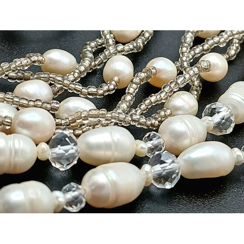 53 - An Attractive Freshwater Pearl Necklace and Bracelet Set. The set is set with irregular freshwater p... 