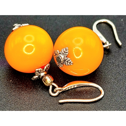22 - A Pretty Pair of 925 Sterling Silver Amber Drop Earrings. Each earring is set with a round amber bea... 